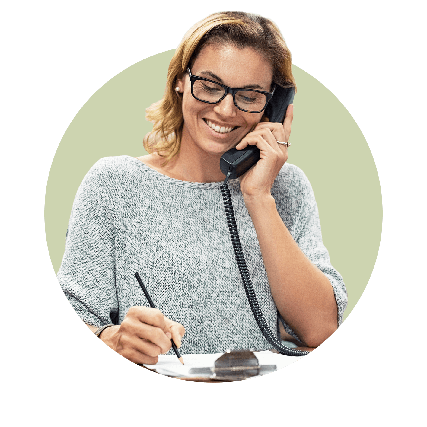 Professional woman smiling whilst on the phone and writing notes on a clipboard