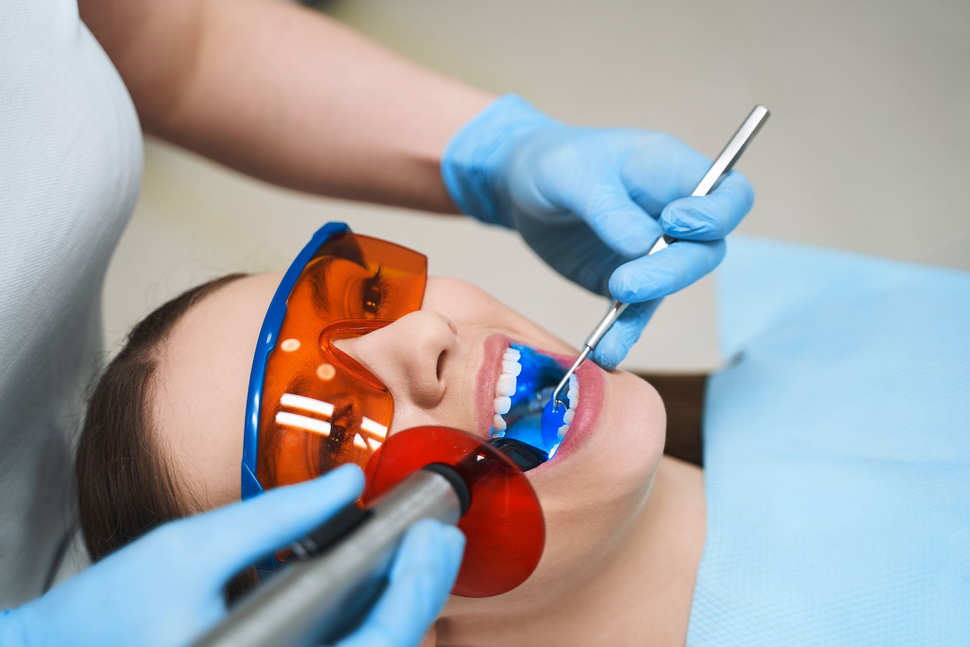 Woman having teeth worked on by dentist