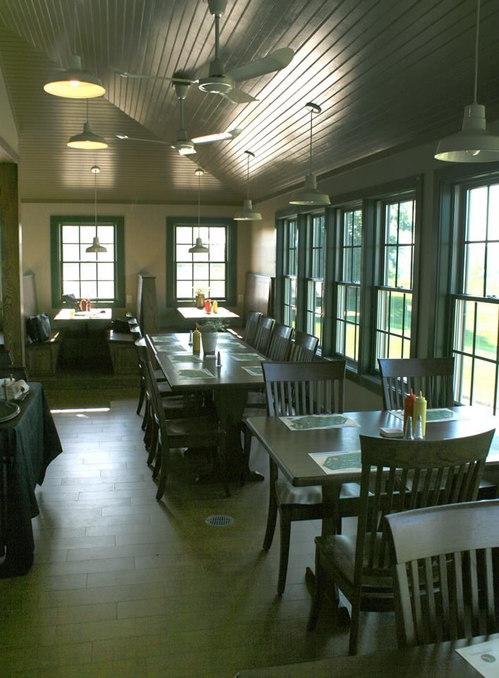 A restaurant with a lot of tables and chairs