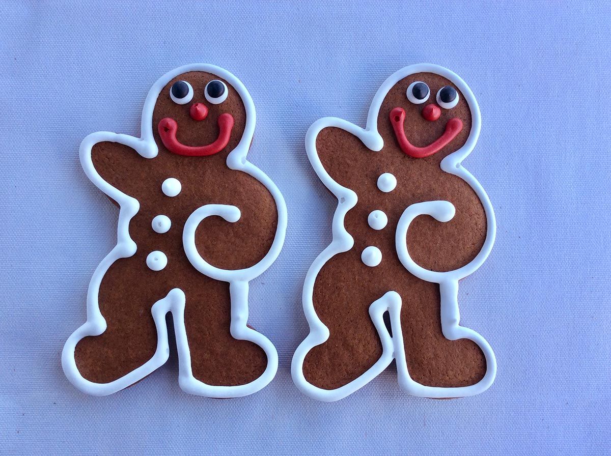 Two gingerbread men with icing.