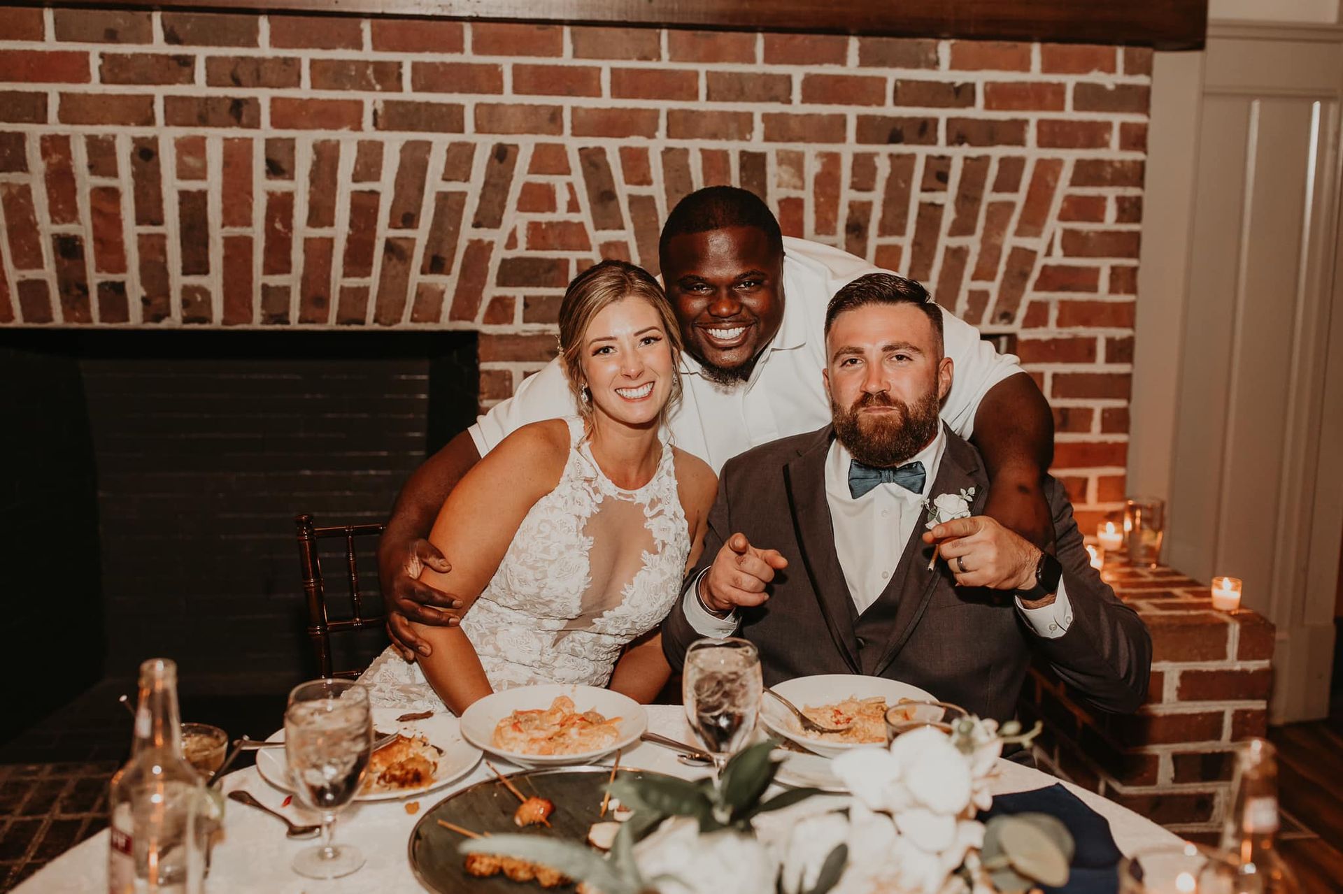 a bride and groom are posing for a picture at their wedding reception  in Charleston, SC
