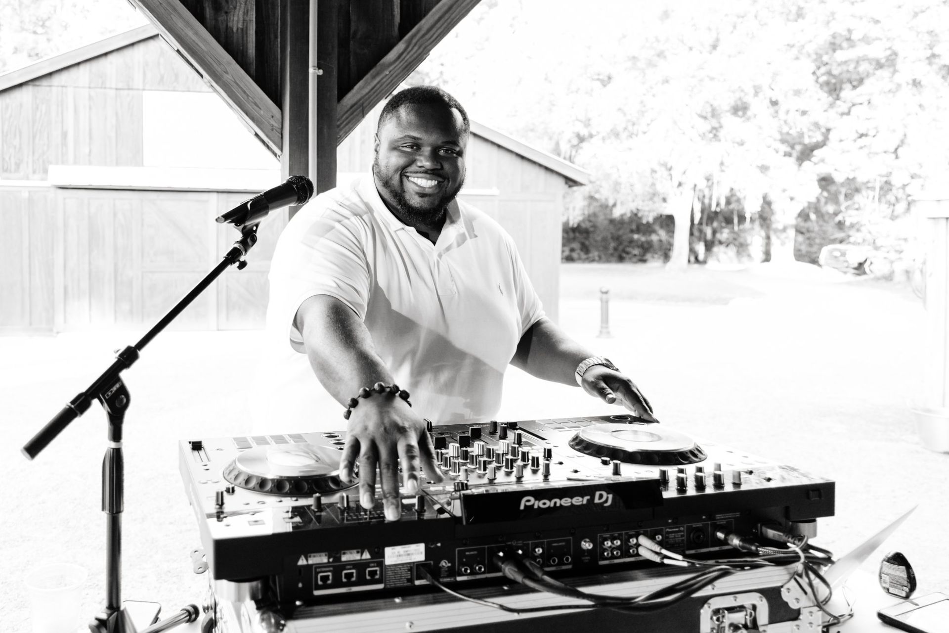 a black and white photo of dj vern playing a dj set in Charleston, SC