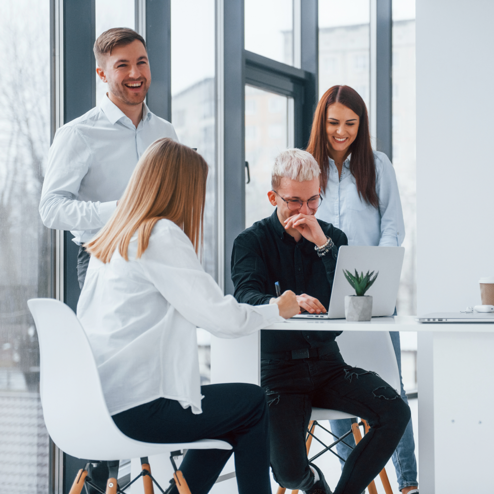A family is sitting on the floor in front of a sliding glass door.