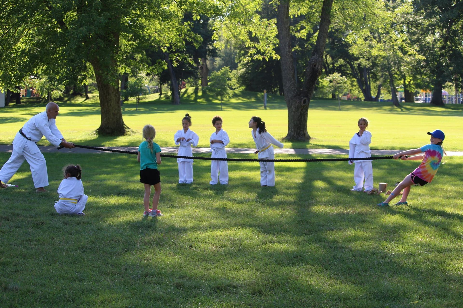 Trainer demonstrating how to play tug of war