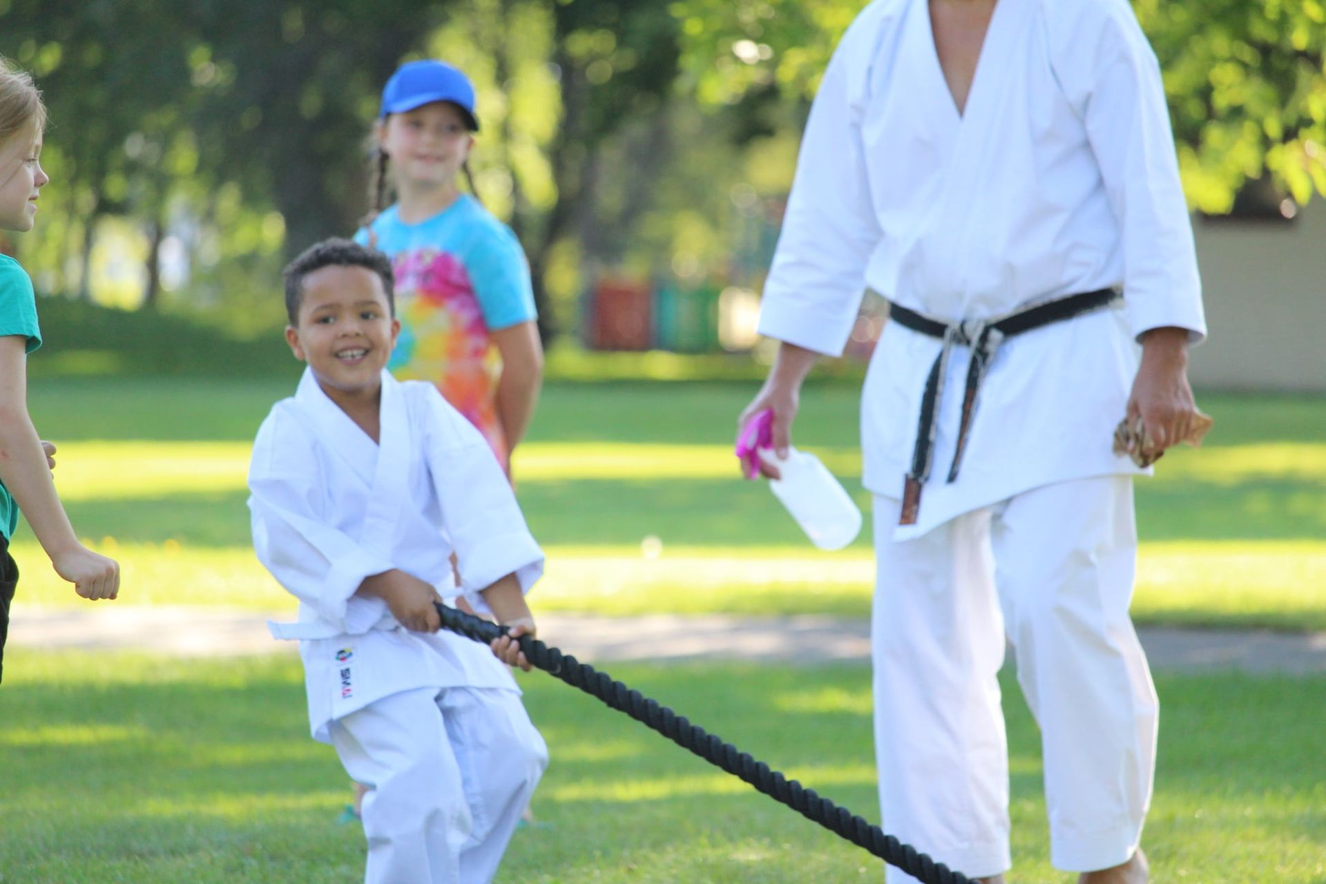 Happy kid playing tug of war