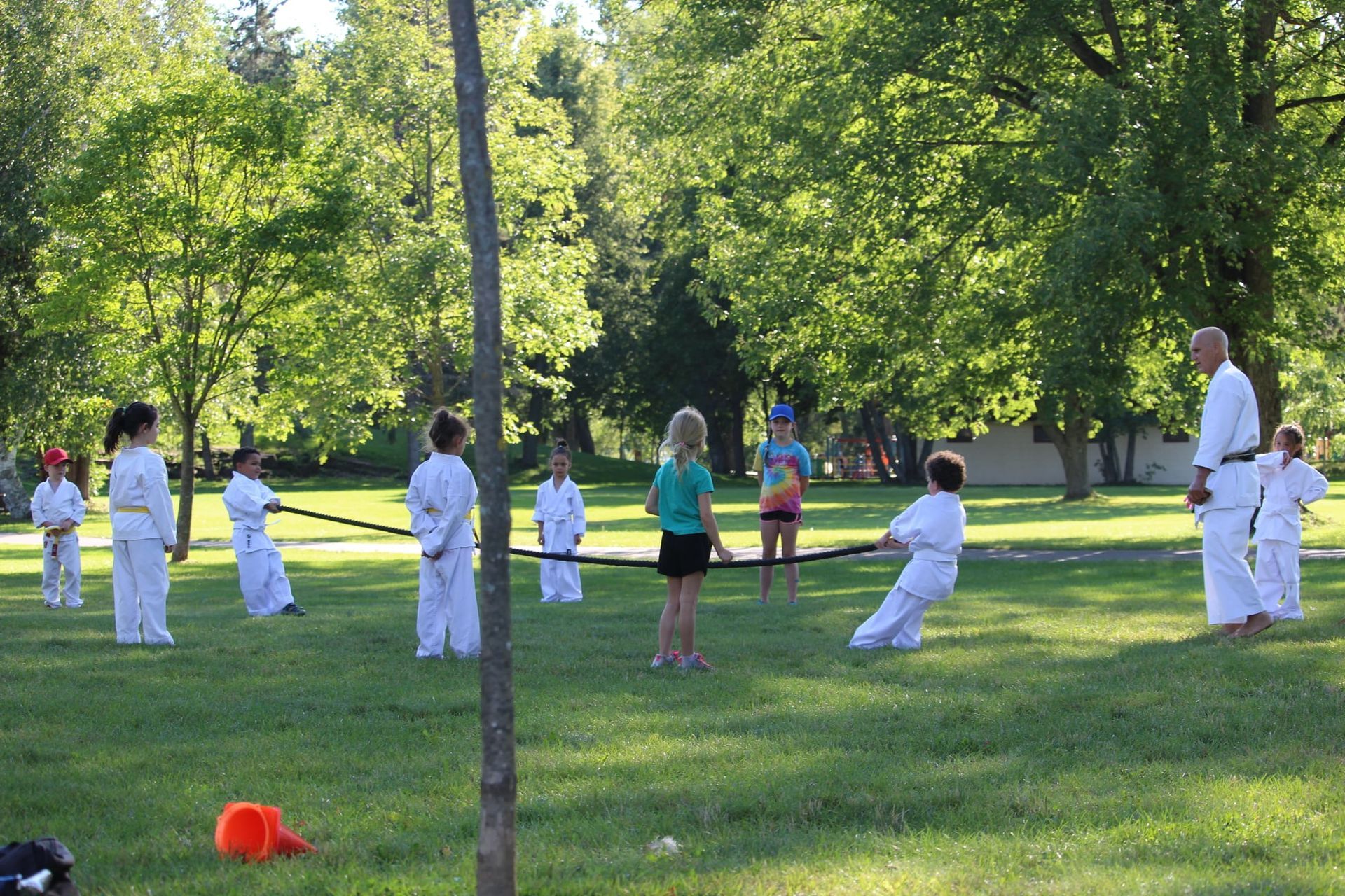 Kids playing tug of war in park