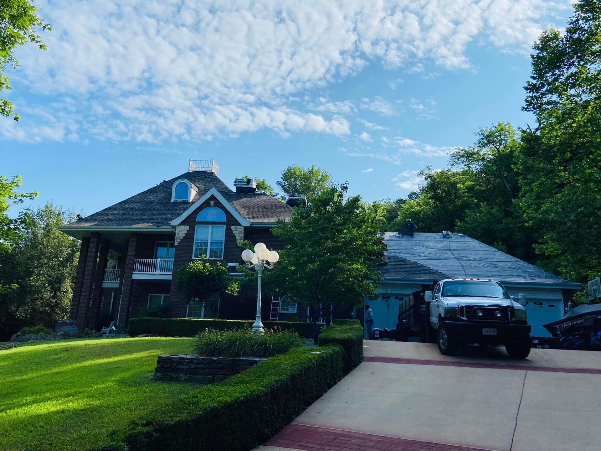 A large house with a car parked in front of it.