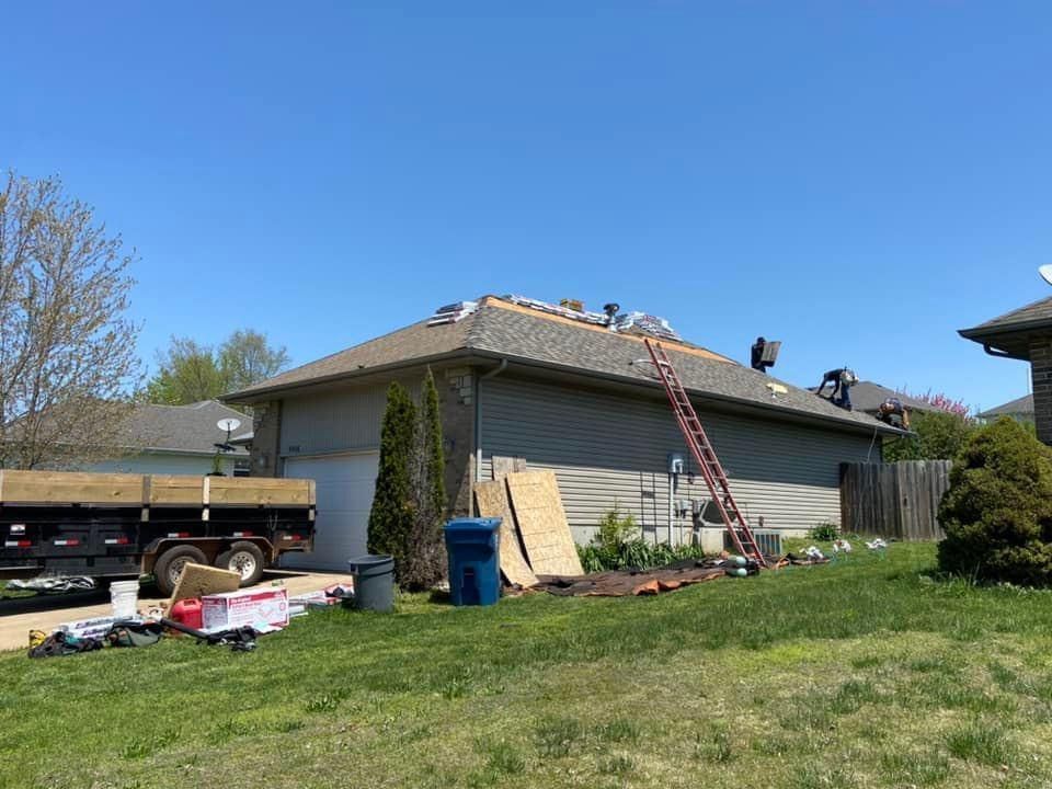 A truck is parked in front of a house that is being remodeled.