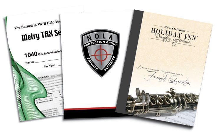 Three brochures with one that says holiday inn on it