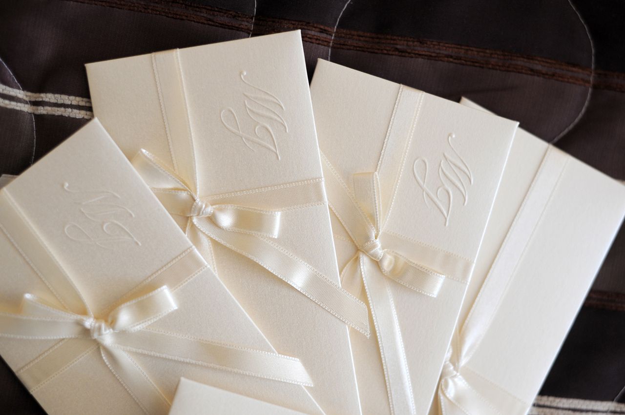 A bunch of white envelopes with the letter s on them