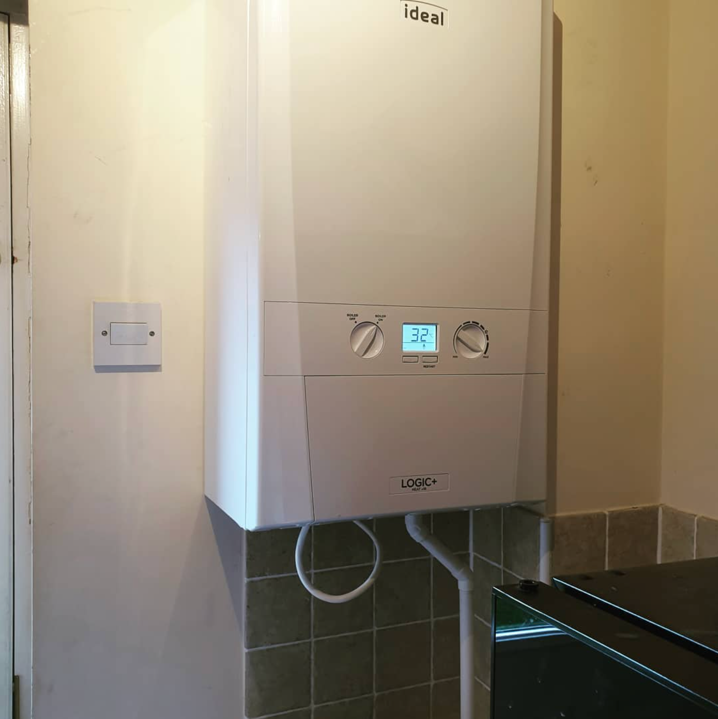 A white boiler with the word ideal on it