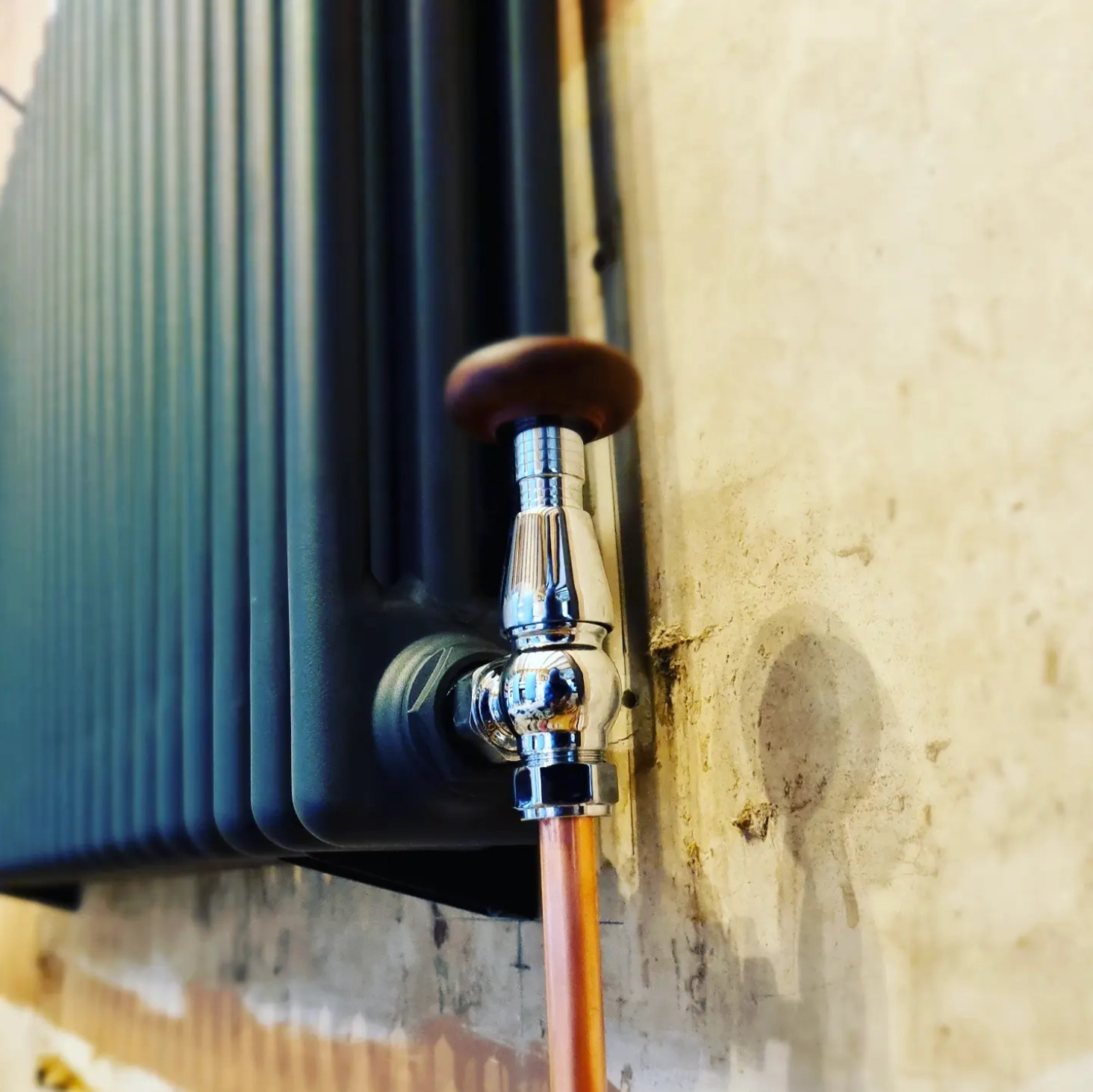 A close up of a radiator with a faucet attached to it