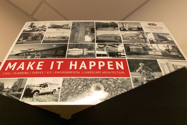 A poster that says make it happen on it