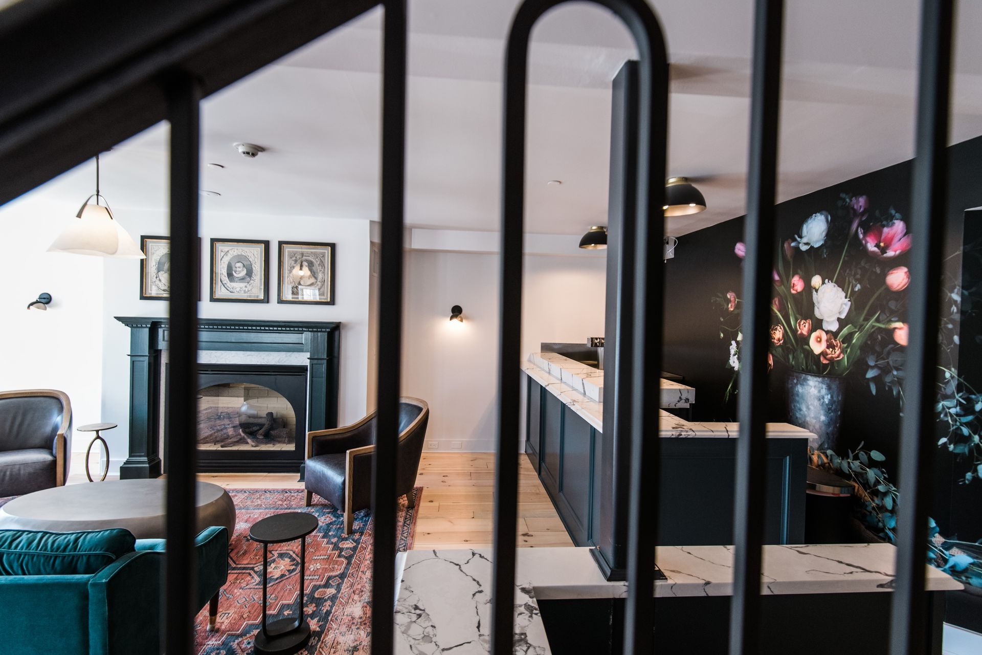 a view of a lounge room through black stair rails