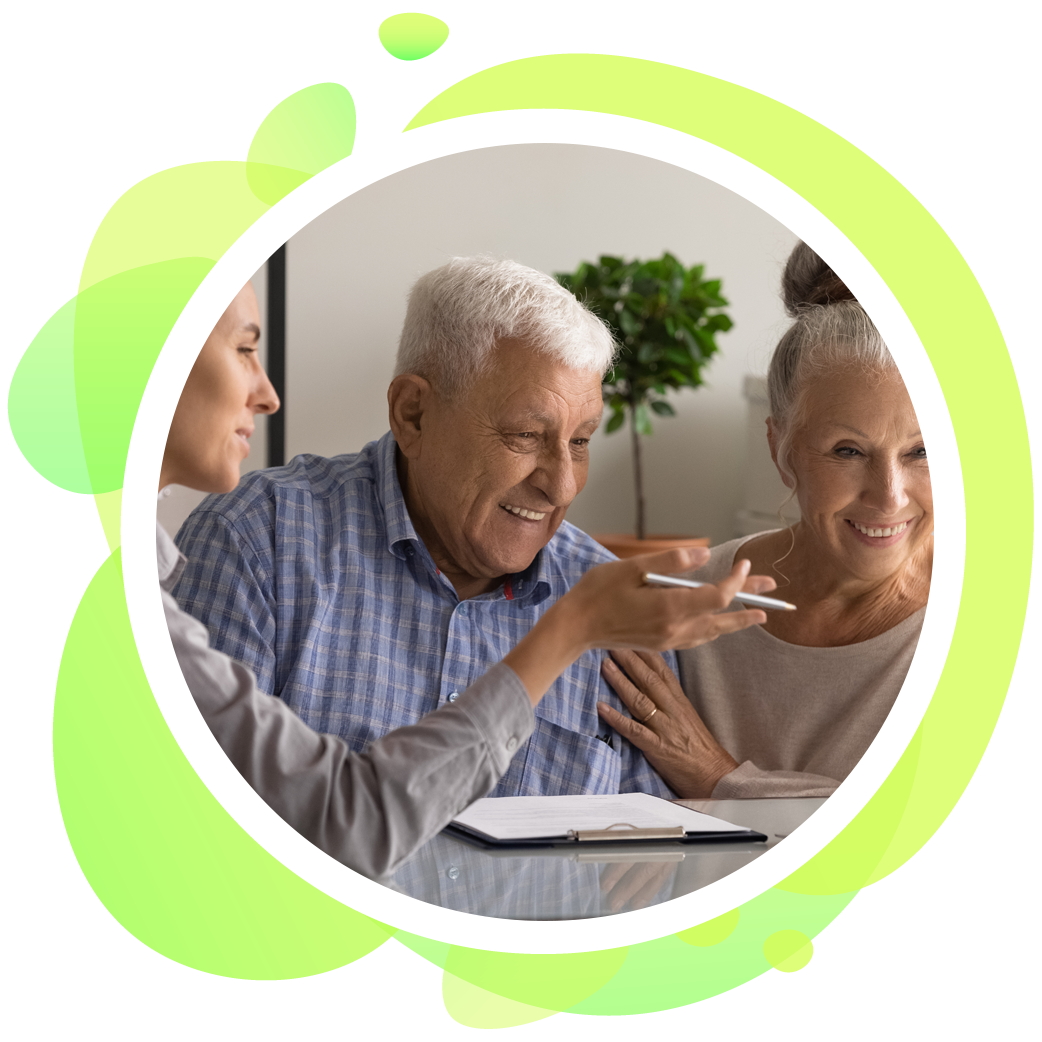 A man and a woman are sitting at a table talking to each other.