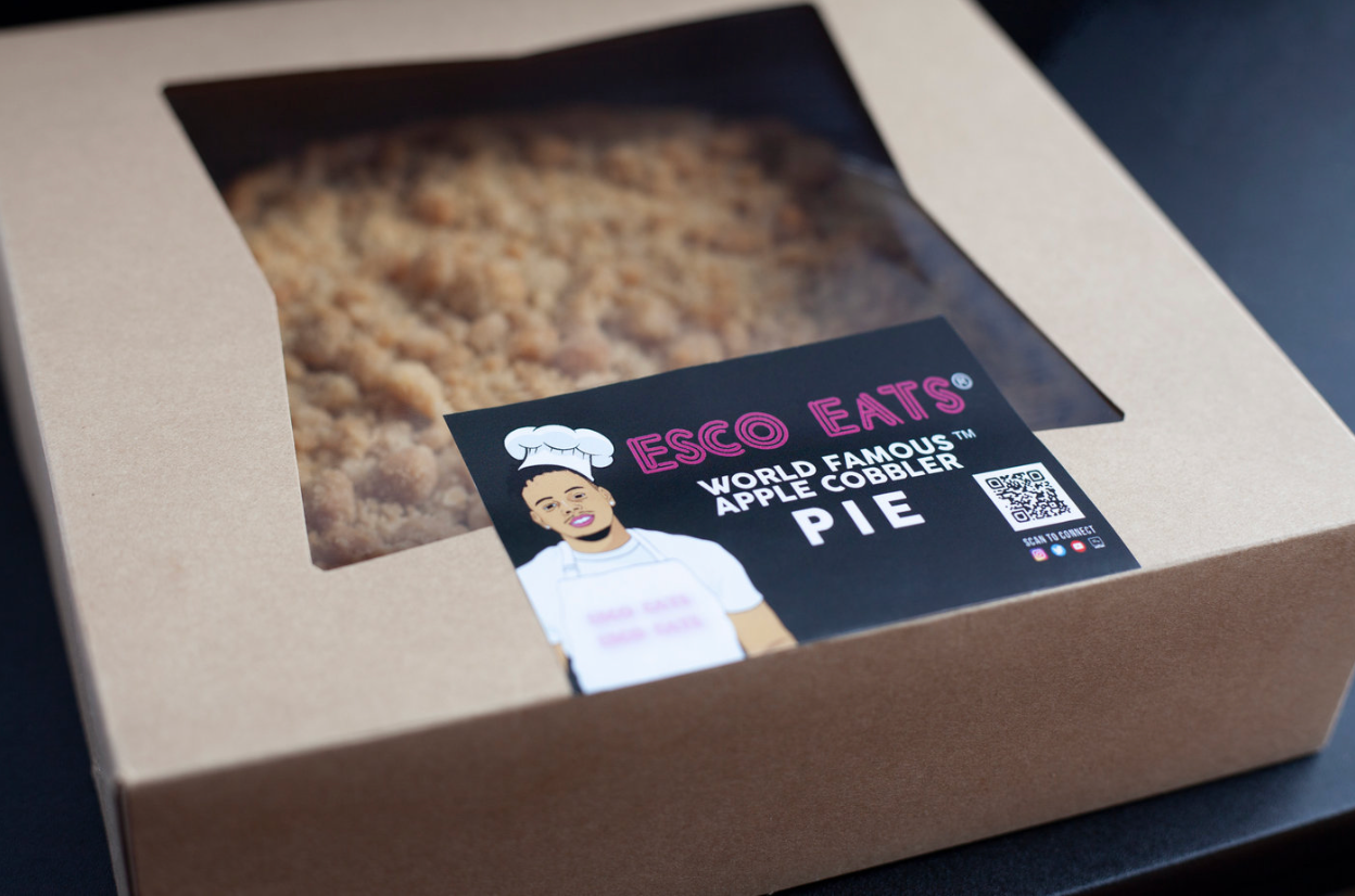 A plate of apple crumble with ice cream on top.