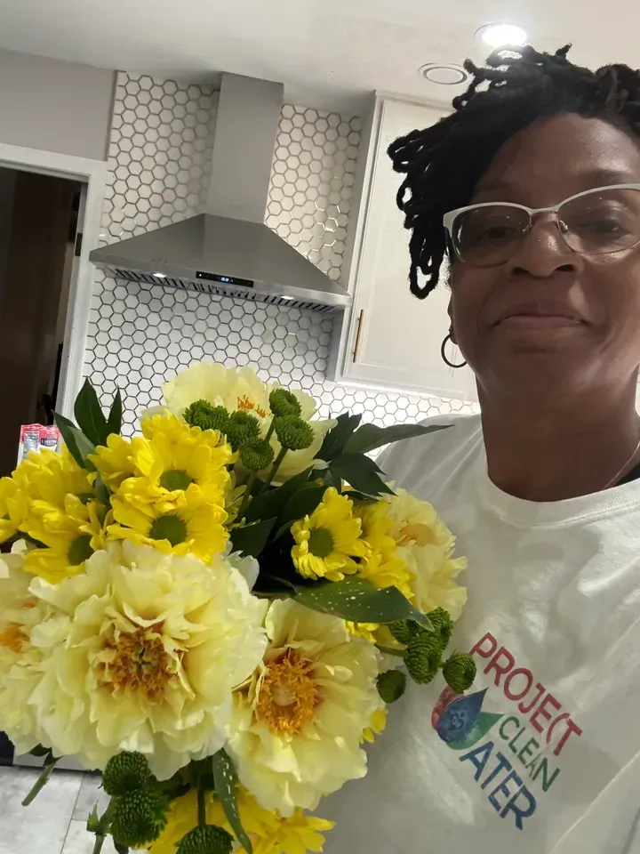 A person wearing glasses and a 