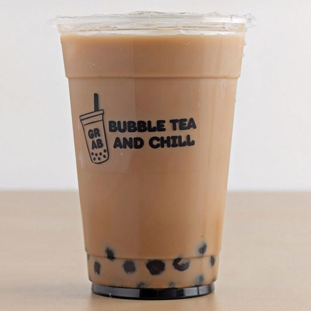 Bubble tea in a clear plastic cup with a black logo, brown drink, and dark tapioca pearls.