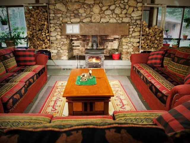 A living room filled with furniture and a fireplace