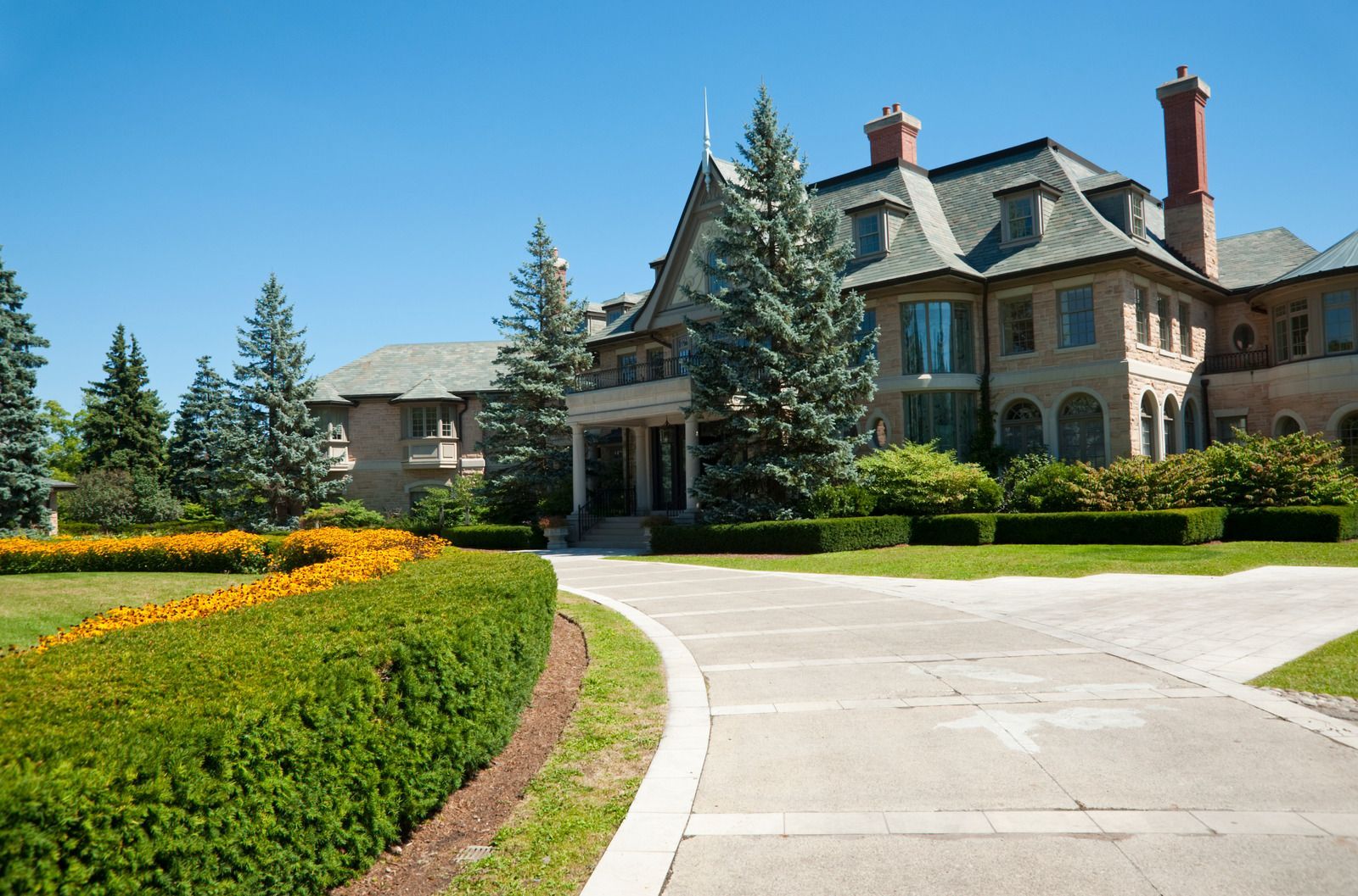 A large house with a driveway leading to it
