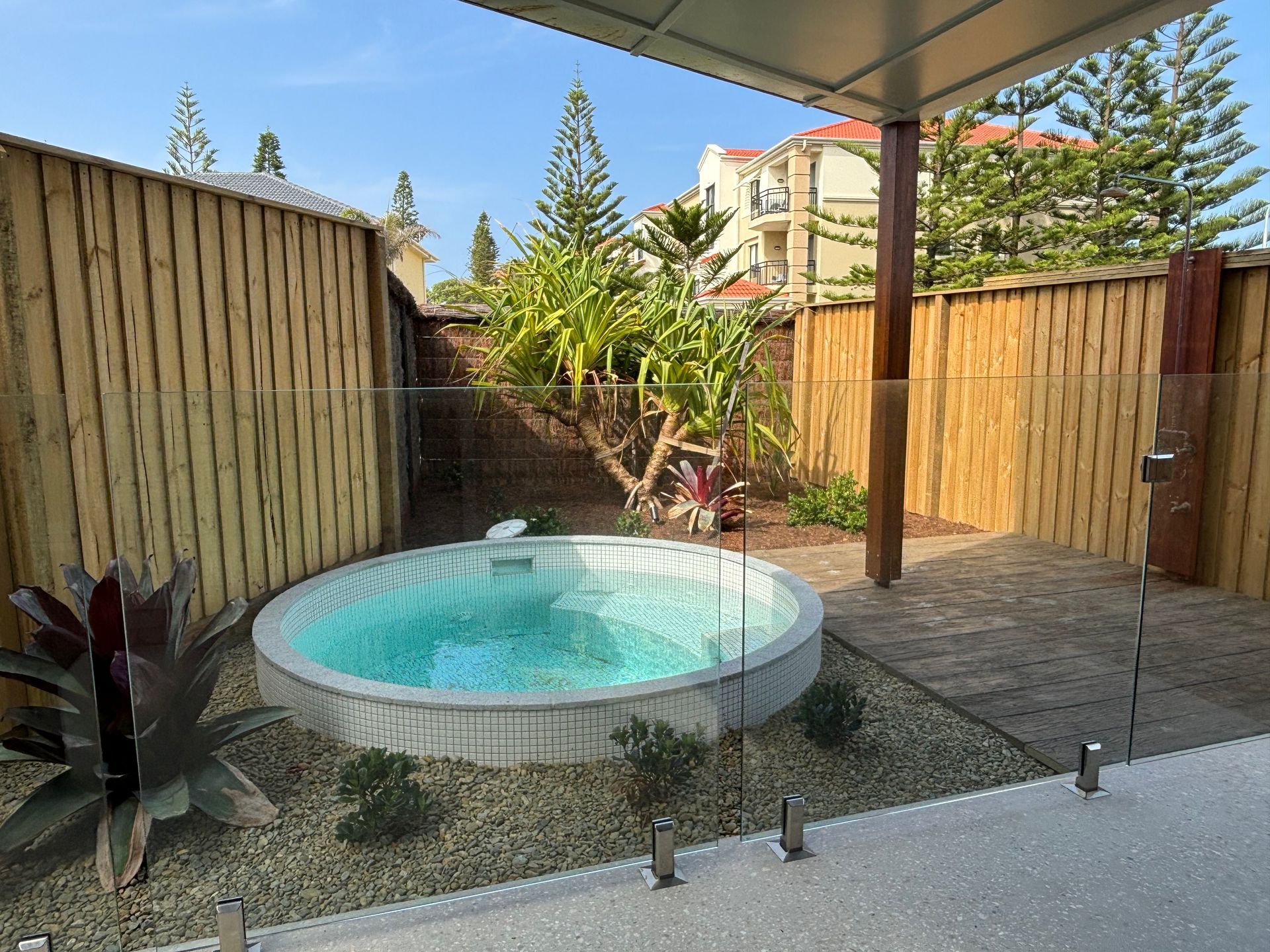 A small pool in garden with fence in the background — Tim Williams Landscapes in Wollongbar, NSW