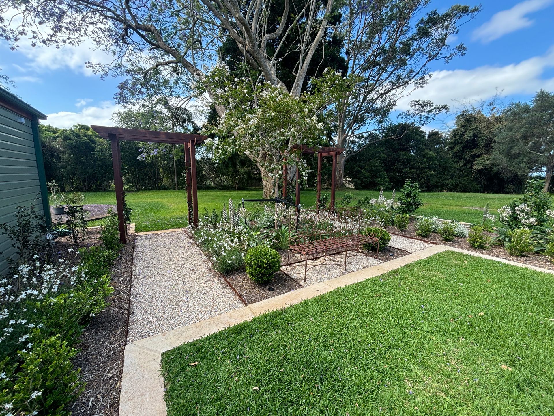 A back garden with trees and plants — Tim Williams Landscapes in Wollongbar, NSW