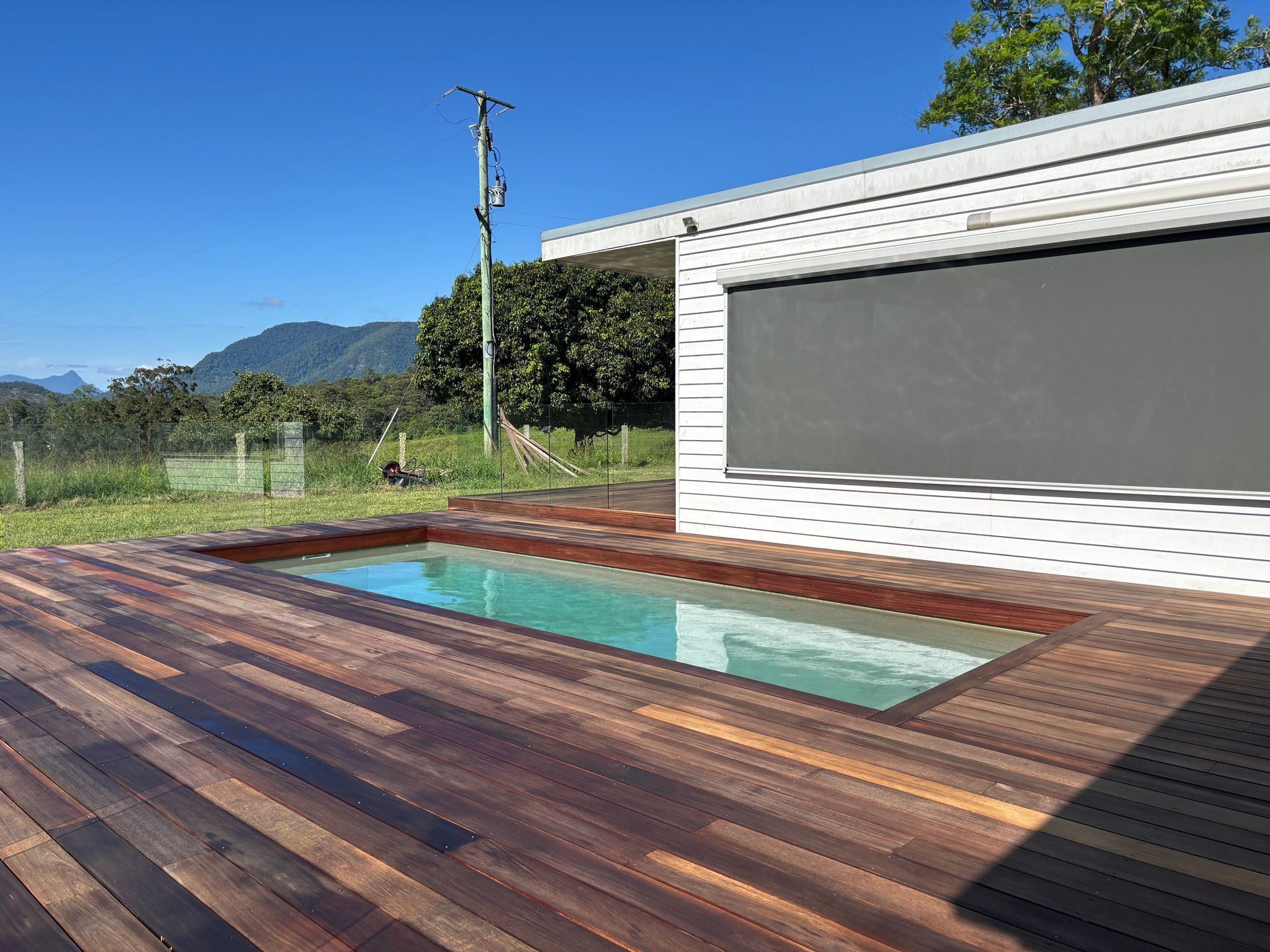 A freshly built deck with a small pool built in the middle — Tim Williams Landscapes in Wollongbar, NSW