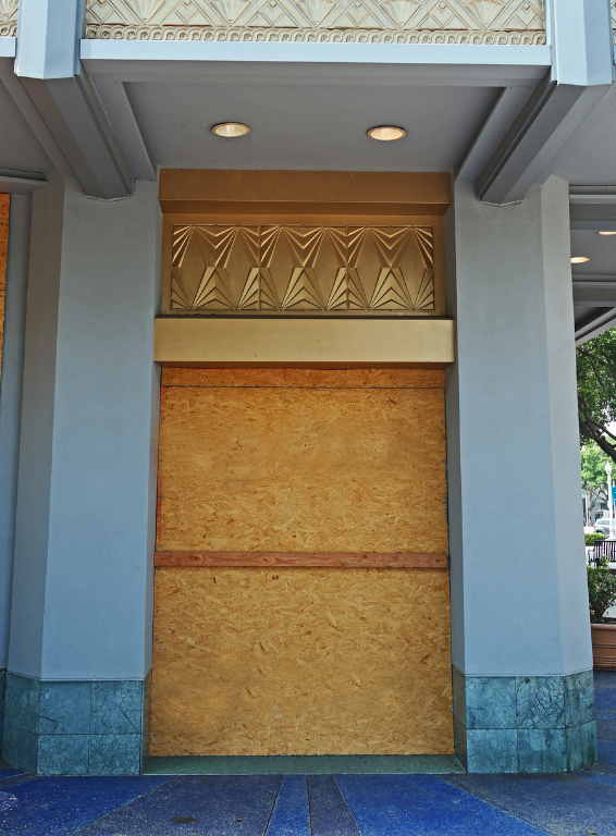 A building with a door that has been boarded up