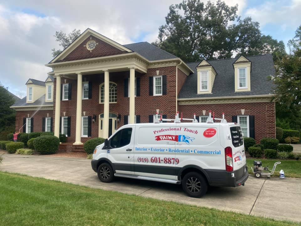 profesional touch paint van in front of house