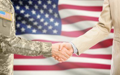 Handshake with American flag background - Garage Door Solutions