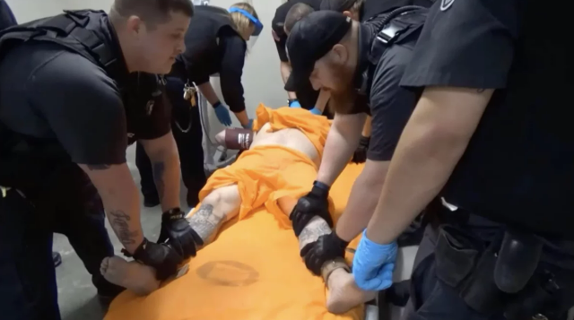 Officers at the US penitentiary in Thomson, IL use a four-point restraint (US Attorney, N. Illinois)