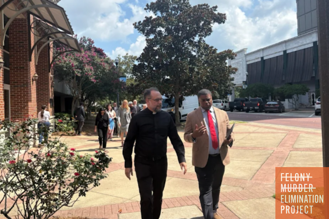 Faith leaders Demetrius Minor, and Fr. Dustin Feddor deliver a petition to the Florida State Capitol