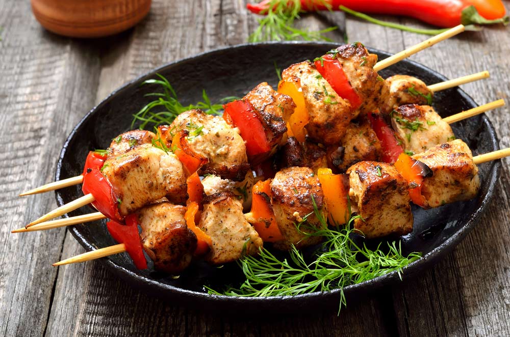 Chicken kebab with bell pepper in frying pan