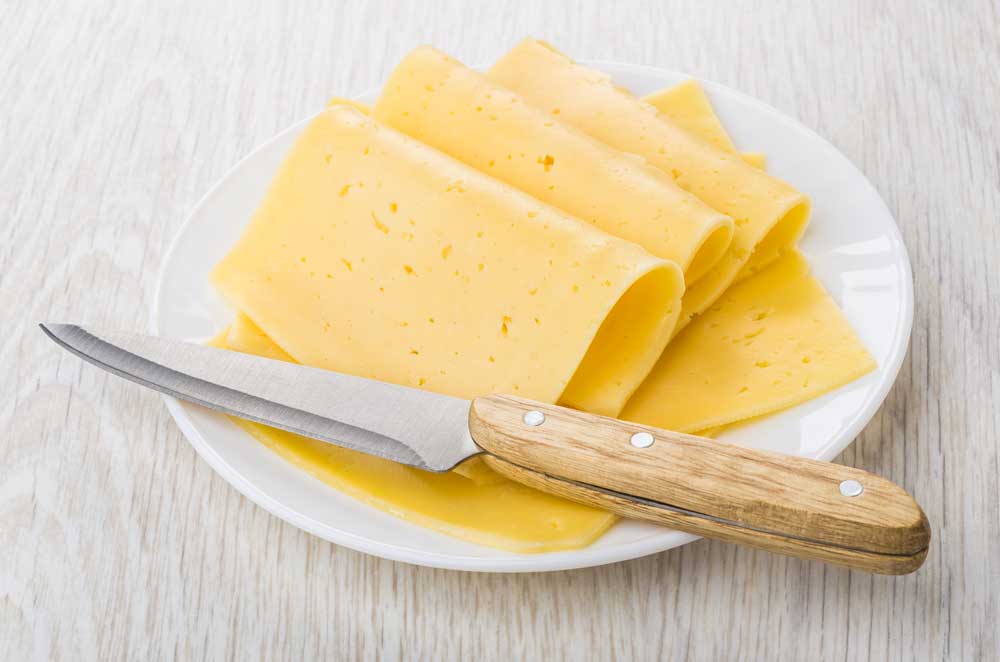 Slices of cheese in plate