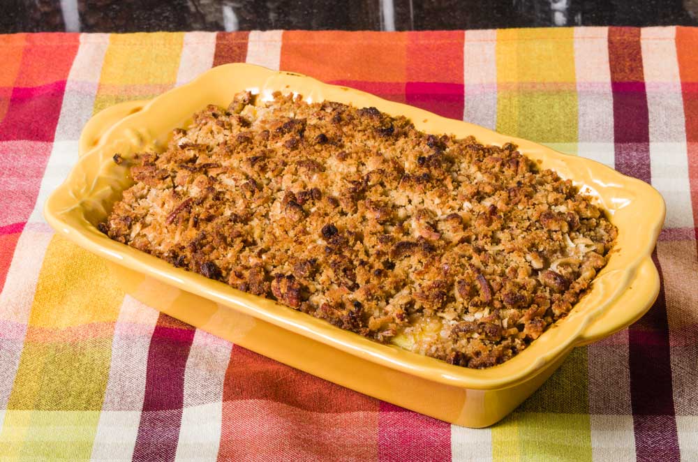 Sweet potato casserole in a yellow casserole dish