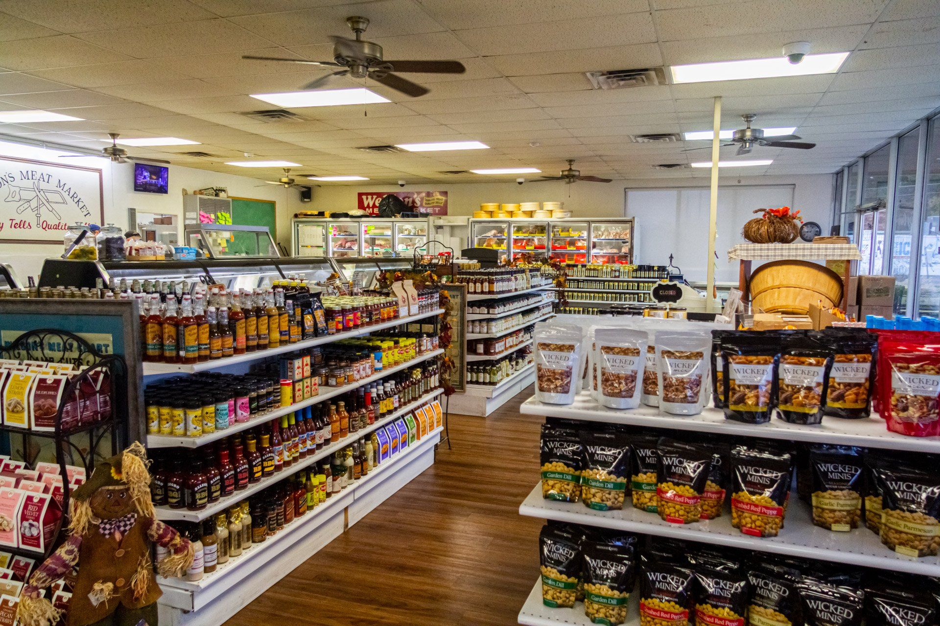 A grocery store filled with lots of shelves of food.