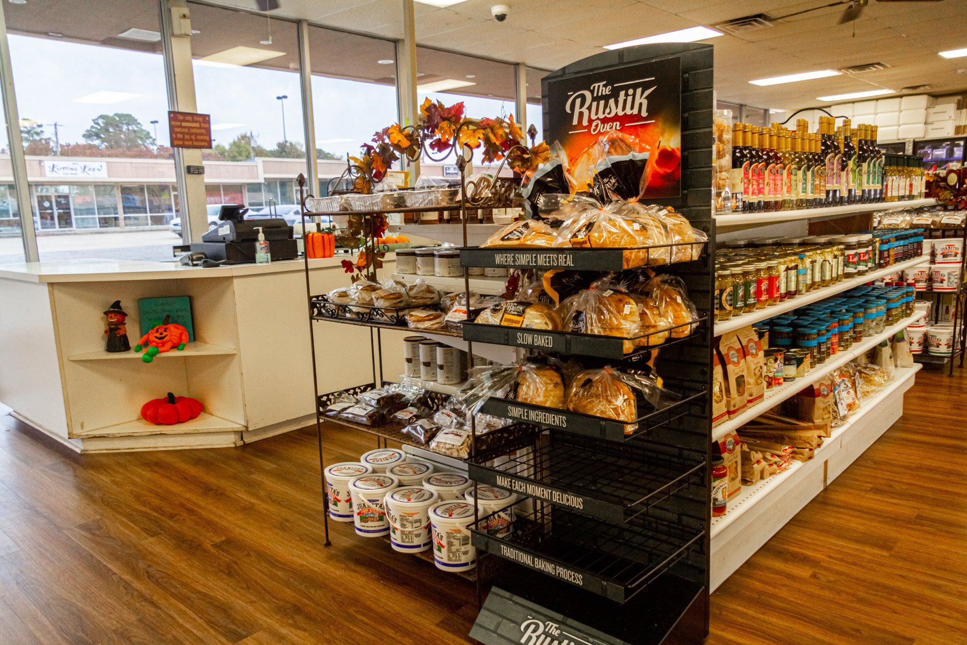A store filled with lots of food and a display of bread.
