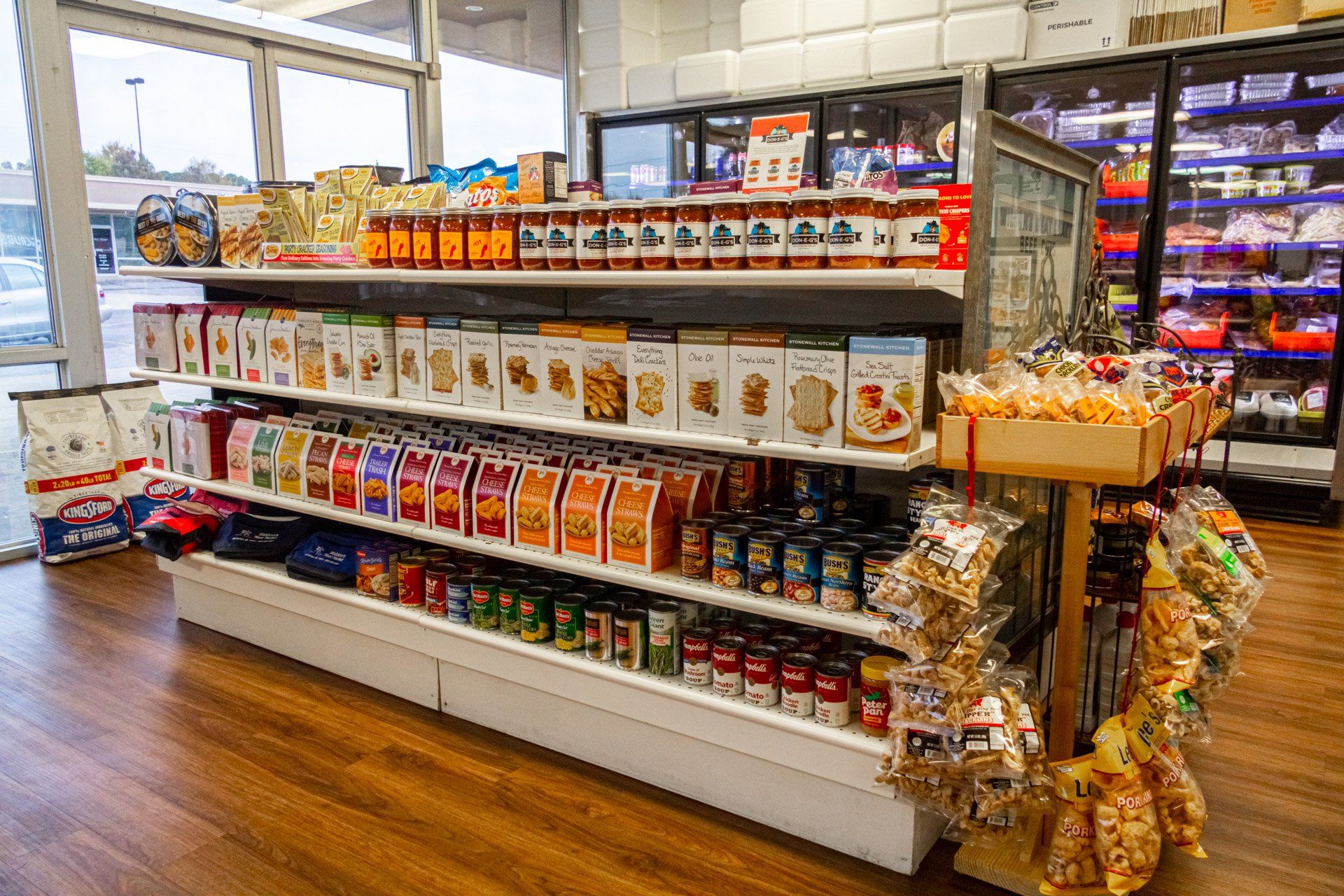 A grocery store aisle filled with lots of food and snacks.
