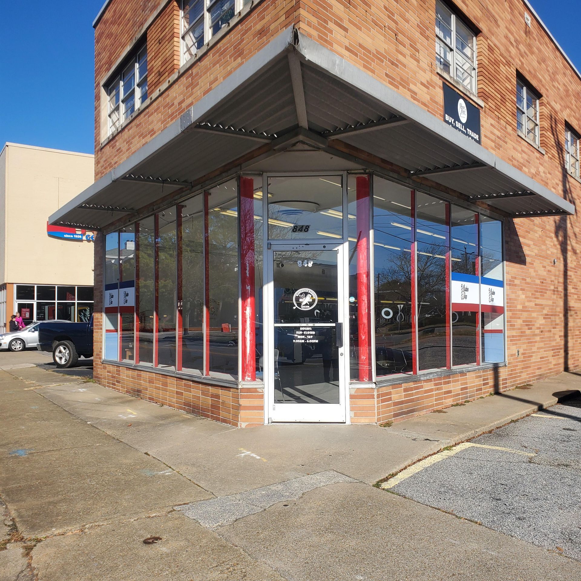 A brick building with a sign that says at & t on it