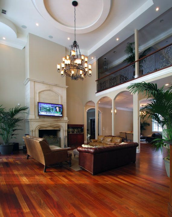 A living room with a fireplace and a flat screen tv