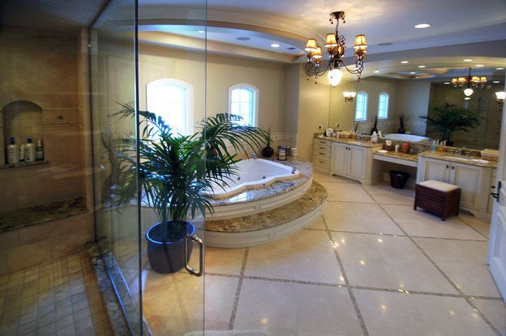 A bathroom with a jacuzzi tub and a walk in shower