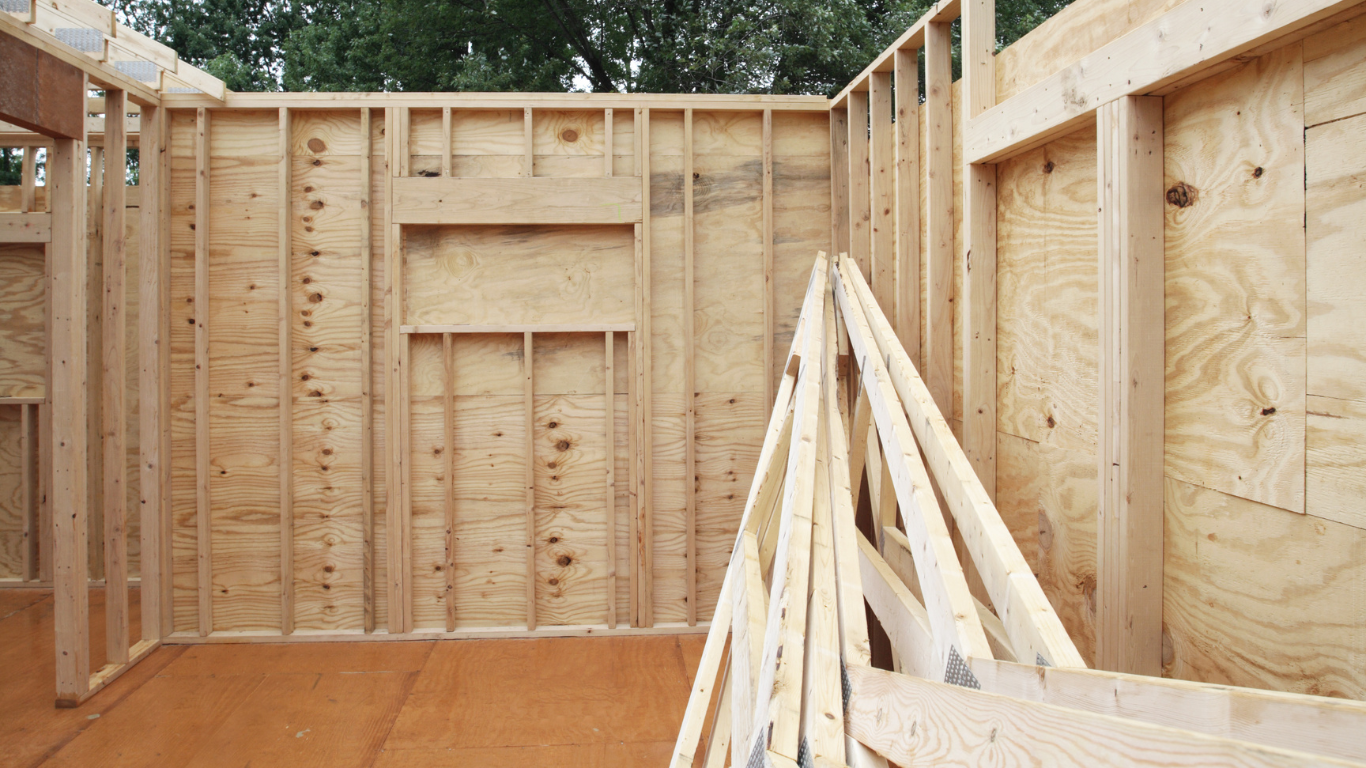 A large house with a brick driveway leading to it