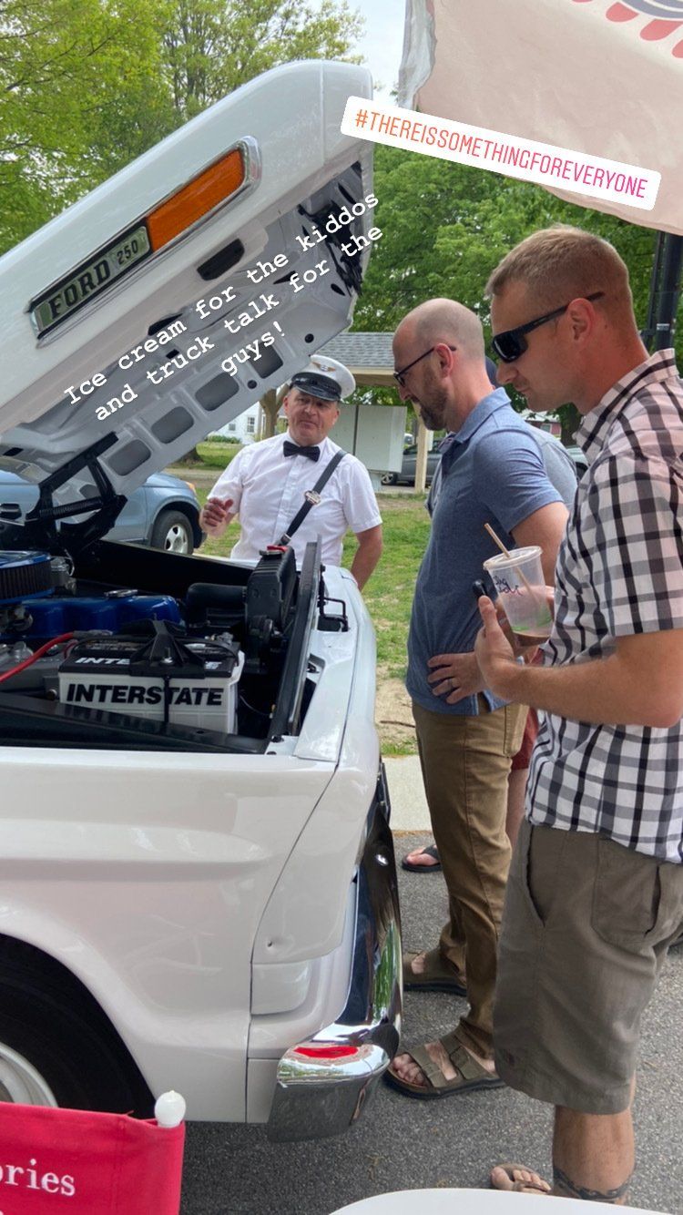 people standing in front of truck