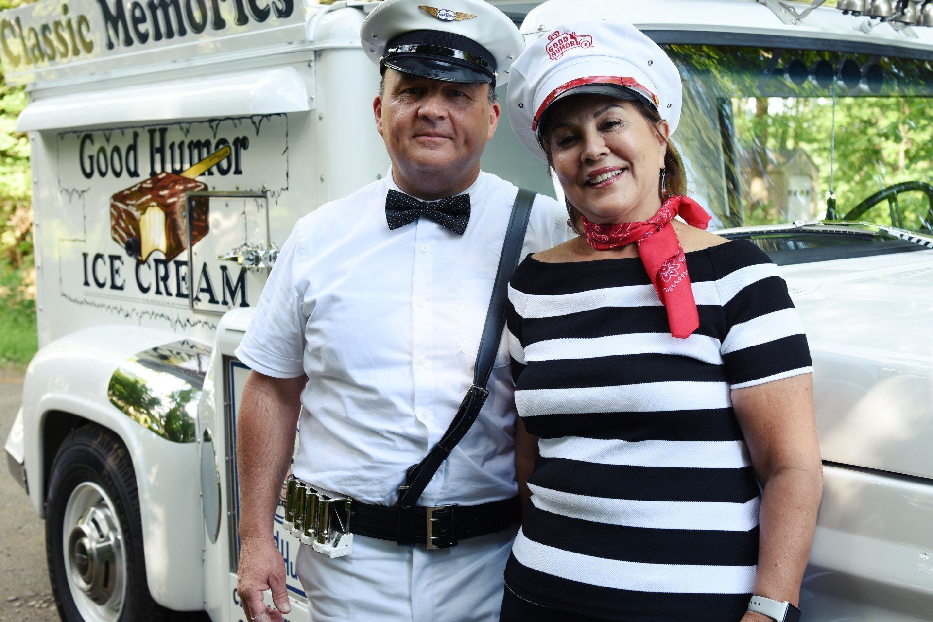 Vintage Ice Cream Truck with 2 people standing in front