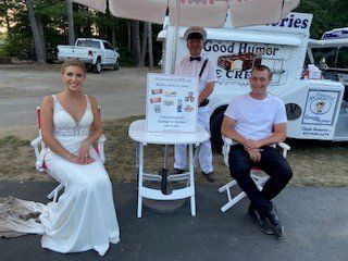 bride with ice cream truck and 2 other people