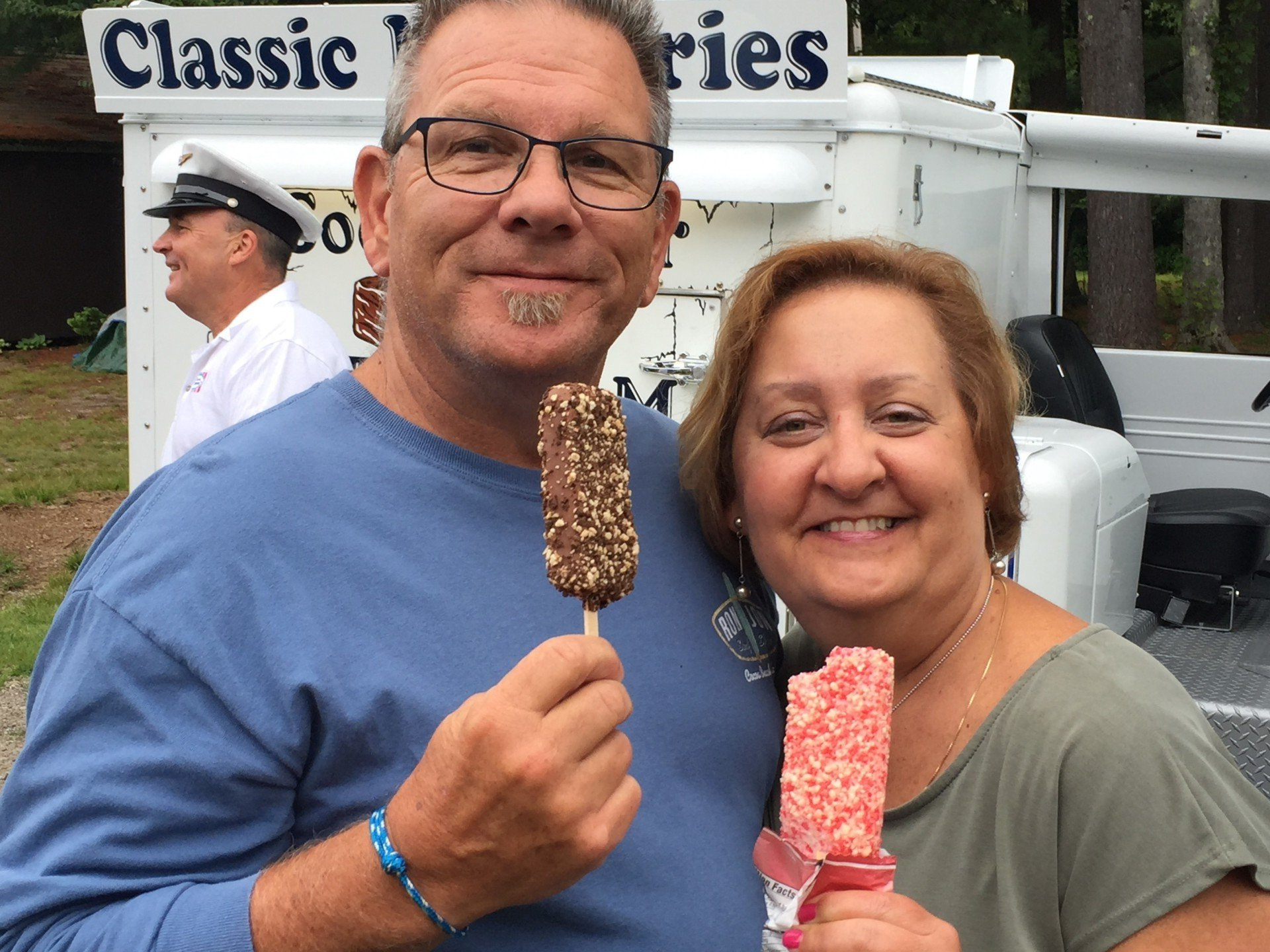 two adults eating ice cream