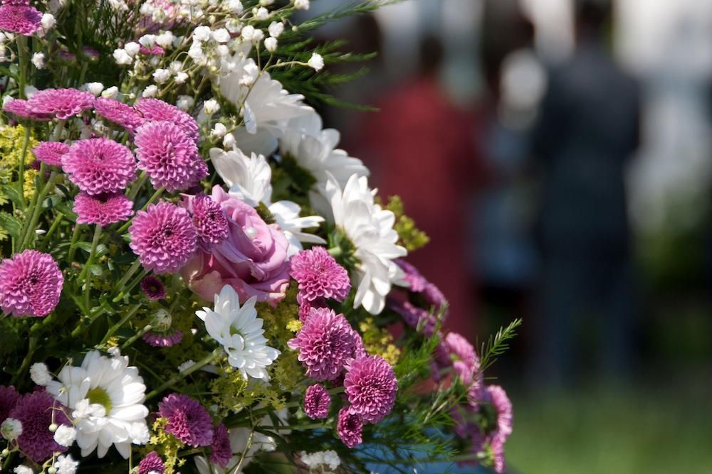 A Close Up of a Bouquet of Flowers With People — Mid Coast Funeral and Cremation Service In Port Macquarie, NSW