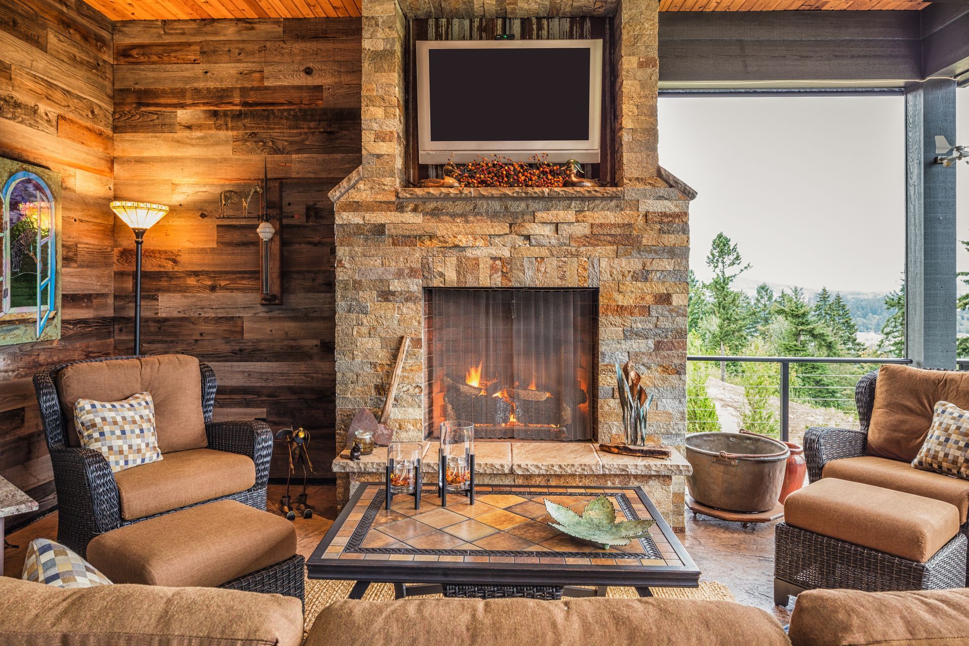 A living room with a fireplace and a flat screen tv.