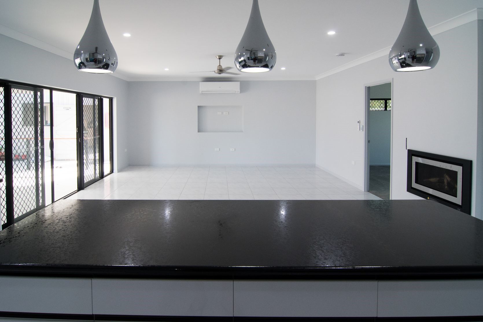 Black Benchtop and waterdrop shaped lights — Cabinet-making in Mareeba, QLD
