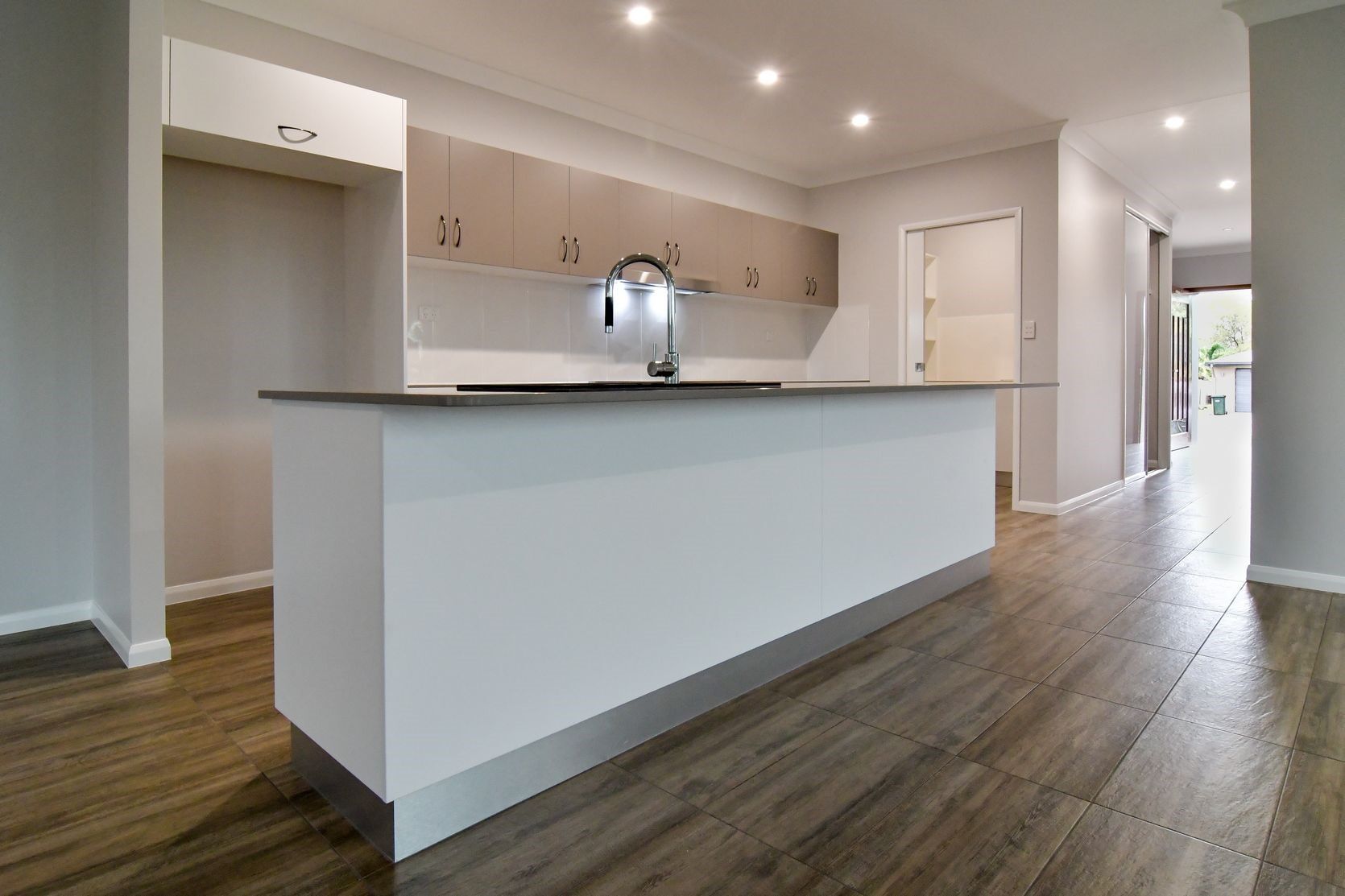 Kitchen with bright lights — Cabinet-making in Mareeba, QLD